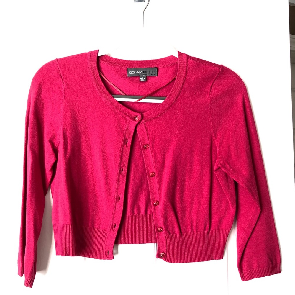 Deep pink cropped cardigan.
